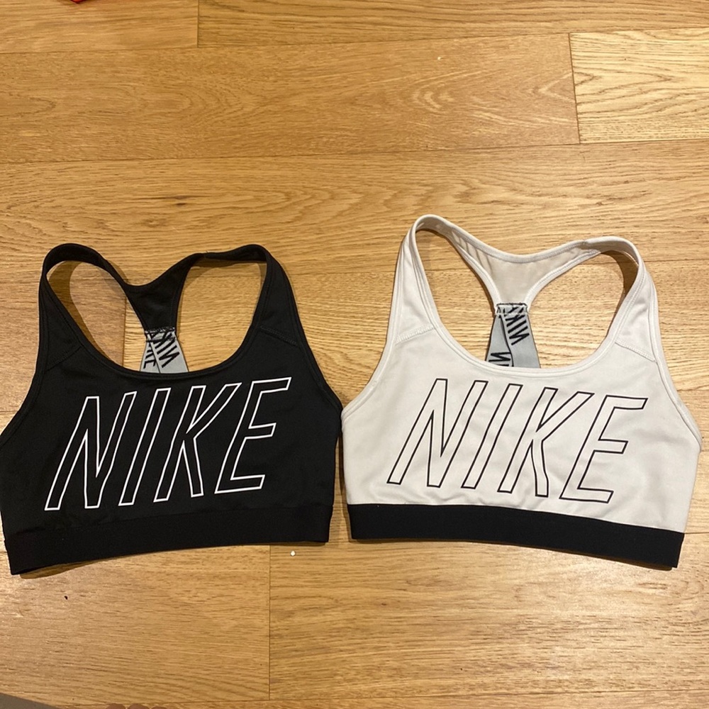 Two Nike logo racer back sports bras